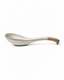 Ceramic soup spoon with natural clay handle shown in side view