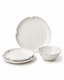 Handmade white scalloped ceramic dinnerware set with dinner plate, side plates and bowl