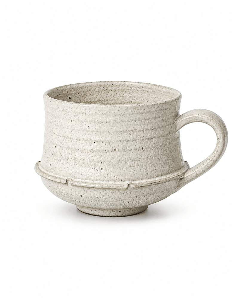 Handmade speckled ceramic mug with rustic white glaze