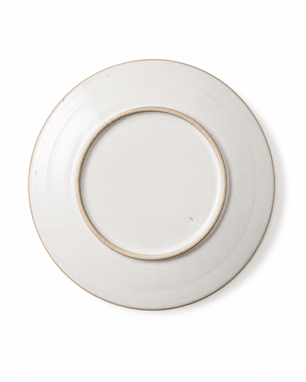 Bottom view of 10 inch ivory white handmade ceramic dinner plate showing raised foot ring