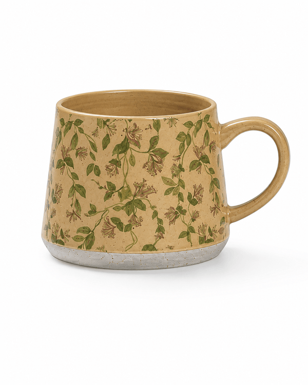Beige botanical ceramic mug with green leafy vines and small floral details