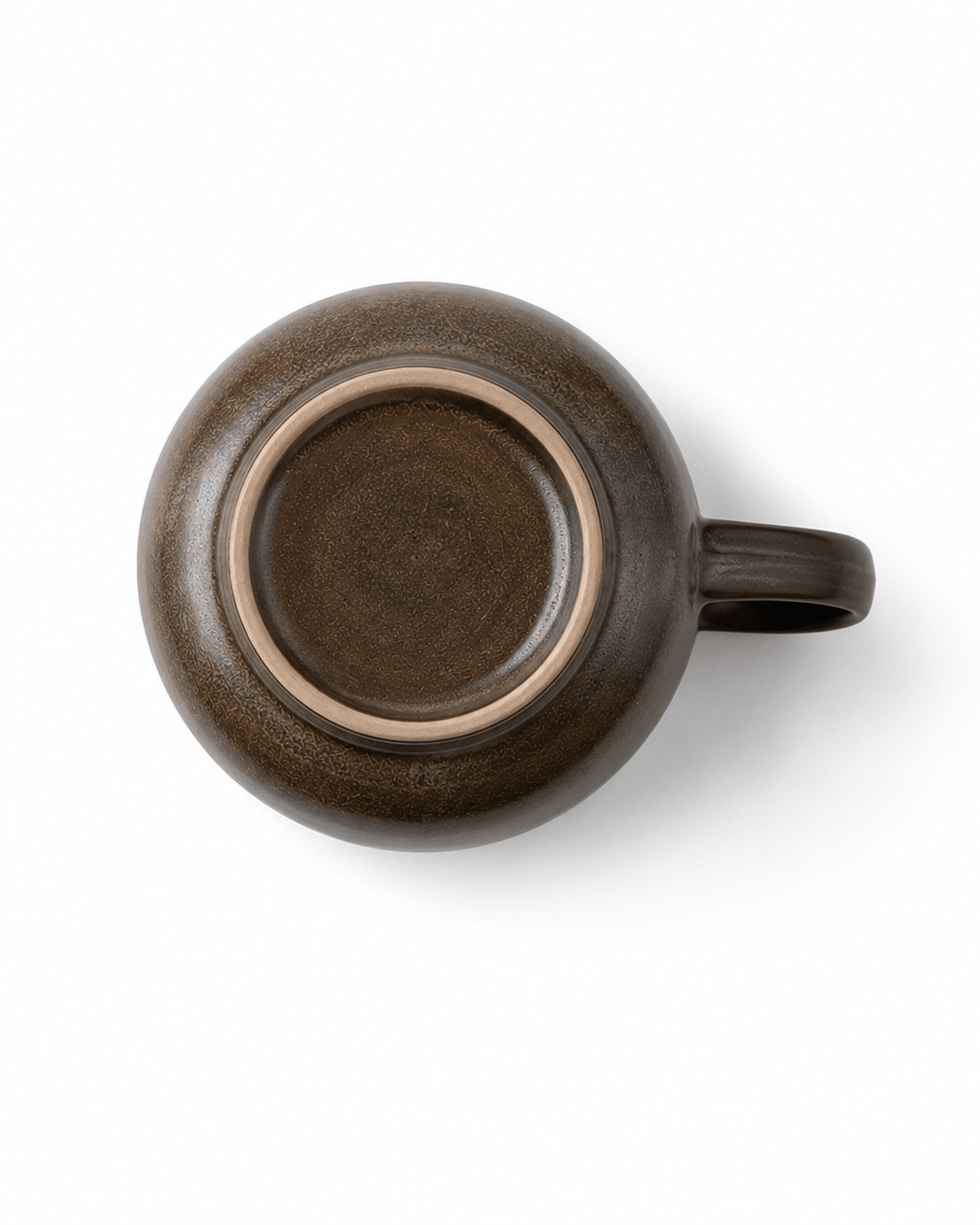 Bottom view of black reactive glaze ceramic coffee cup showing the circular foot ring