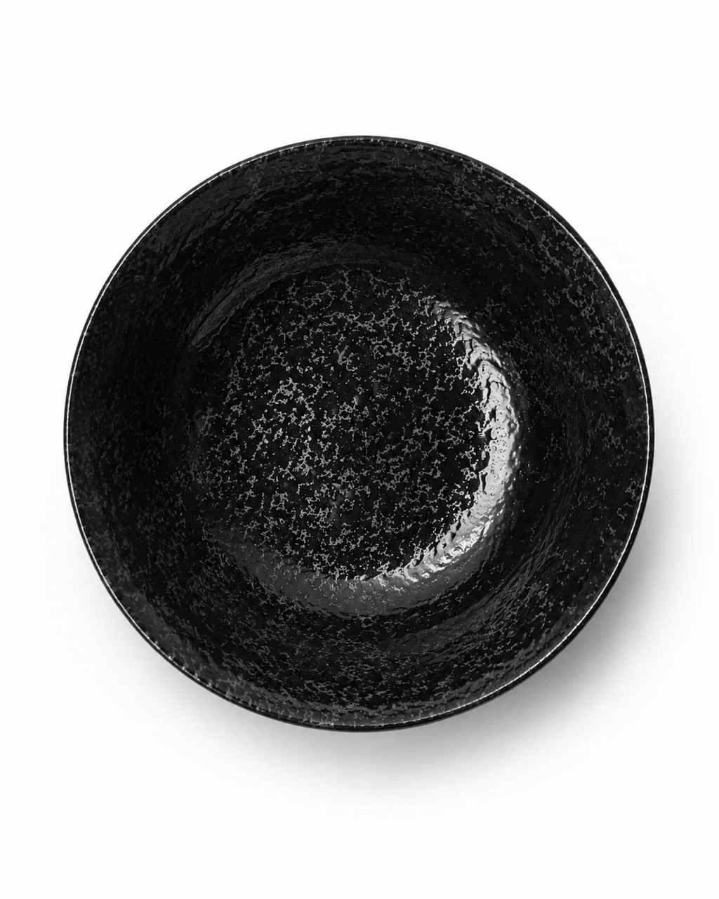 Top view of handmade black reactive glaze stoneware bowl showing glossy speckled interior and textured finish