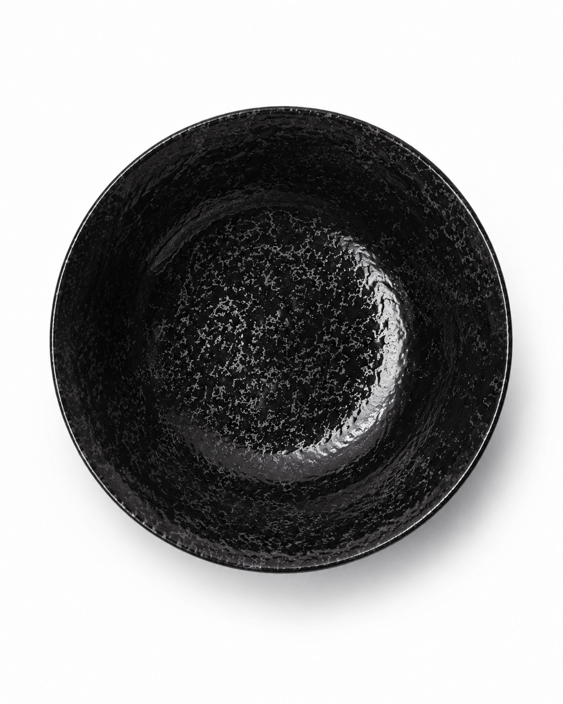 Top view of handmade black reactive glaze stoneware bowl showing glossy speckled interior and textured finish