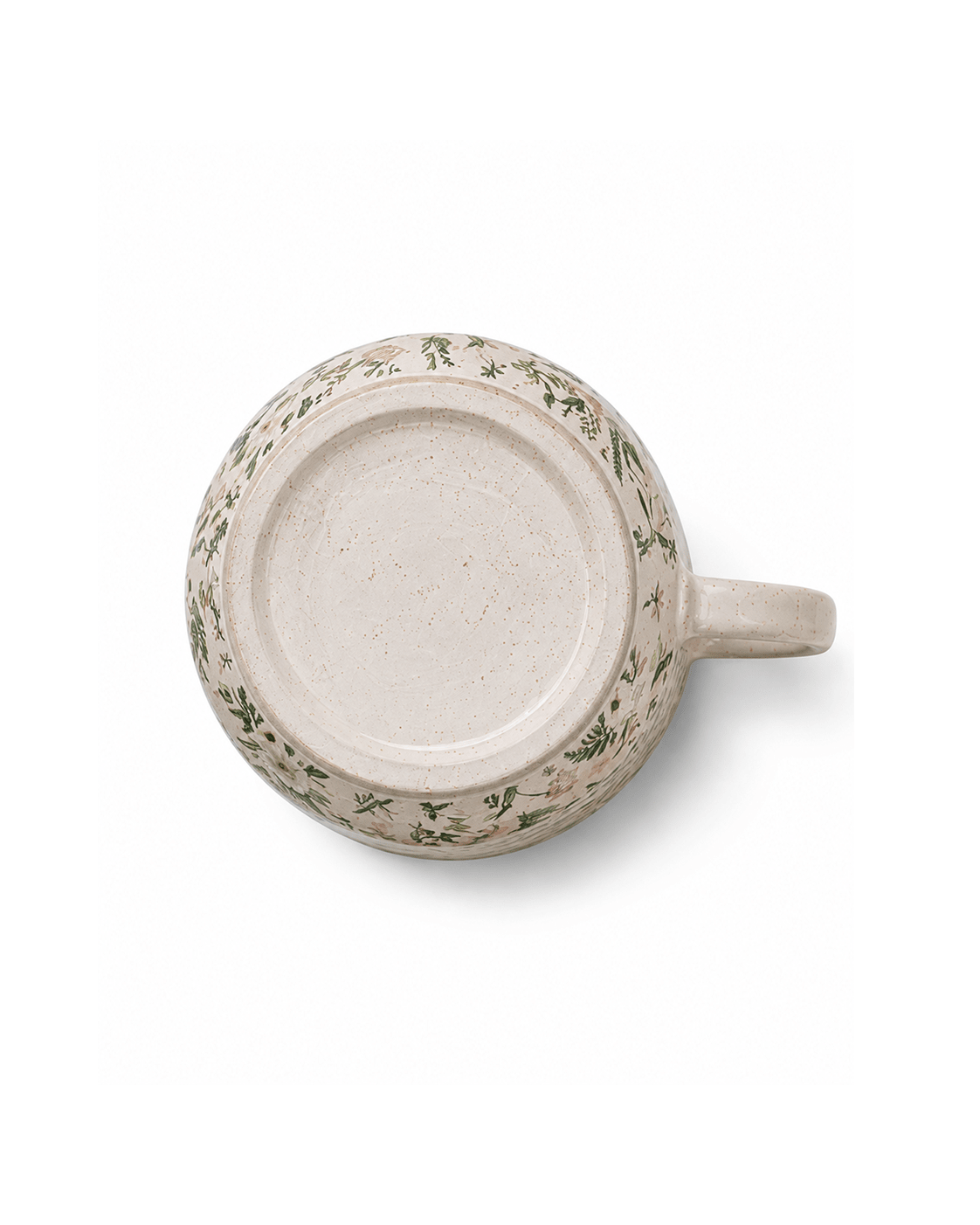 Bottom view of botanical ceramic mug showing the speckled ceramic base and foot ring