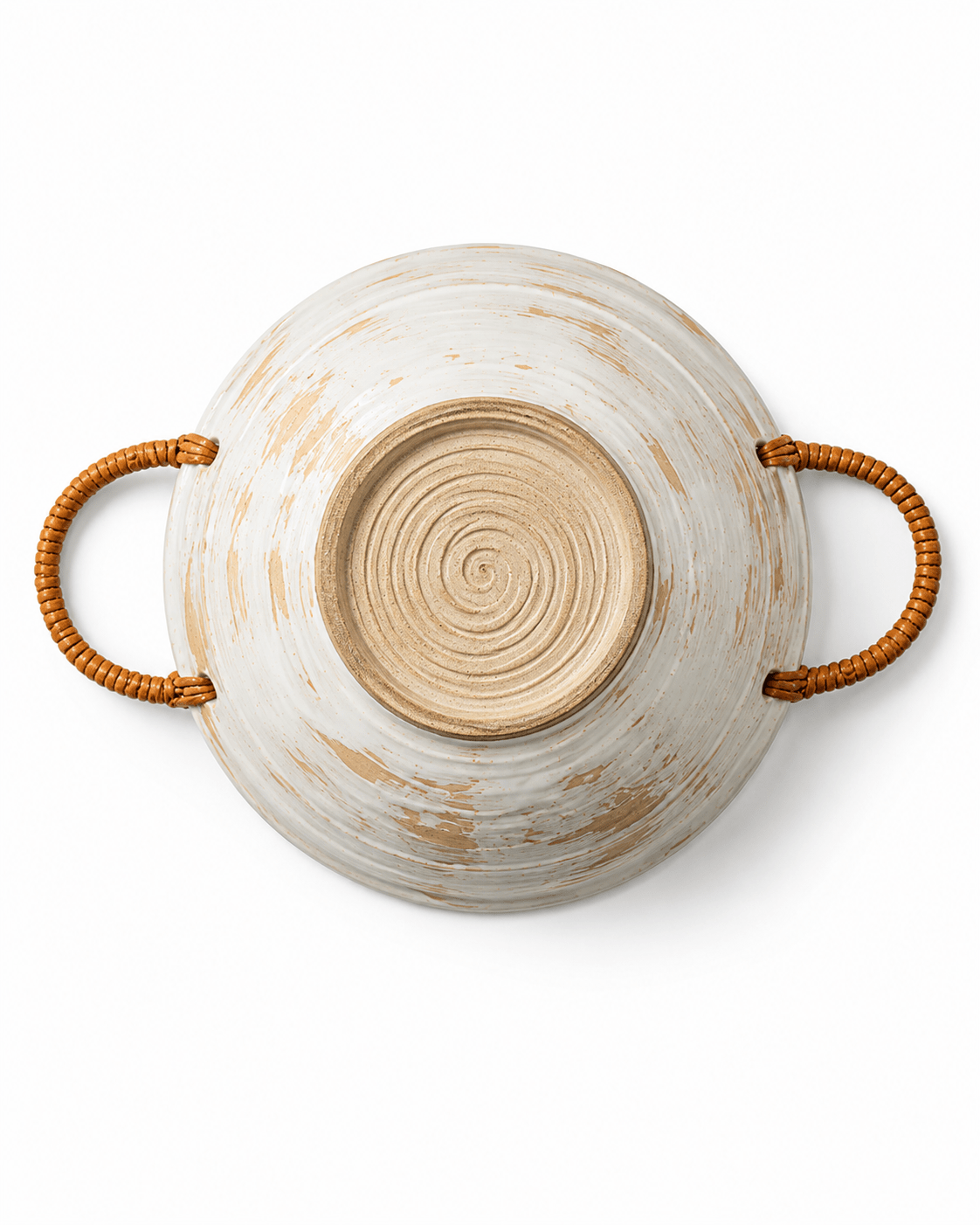 Bottom view of a handmade ceramic bowl with woven rattan handles, natural clay base and visible pottery wheel texture