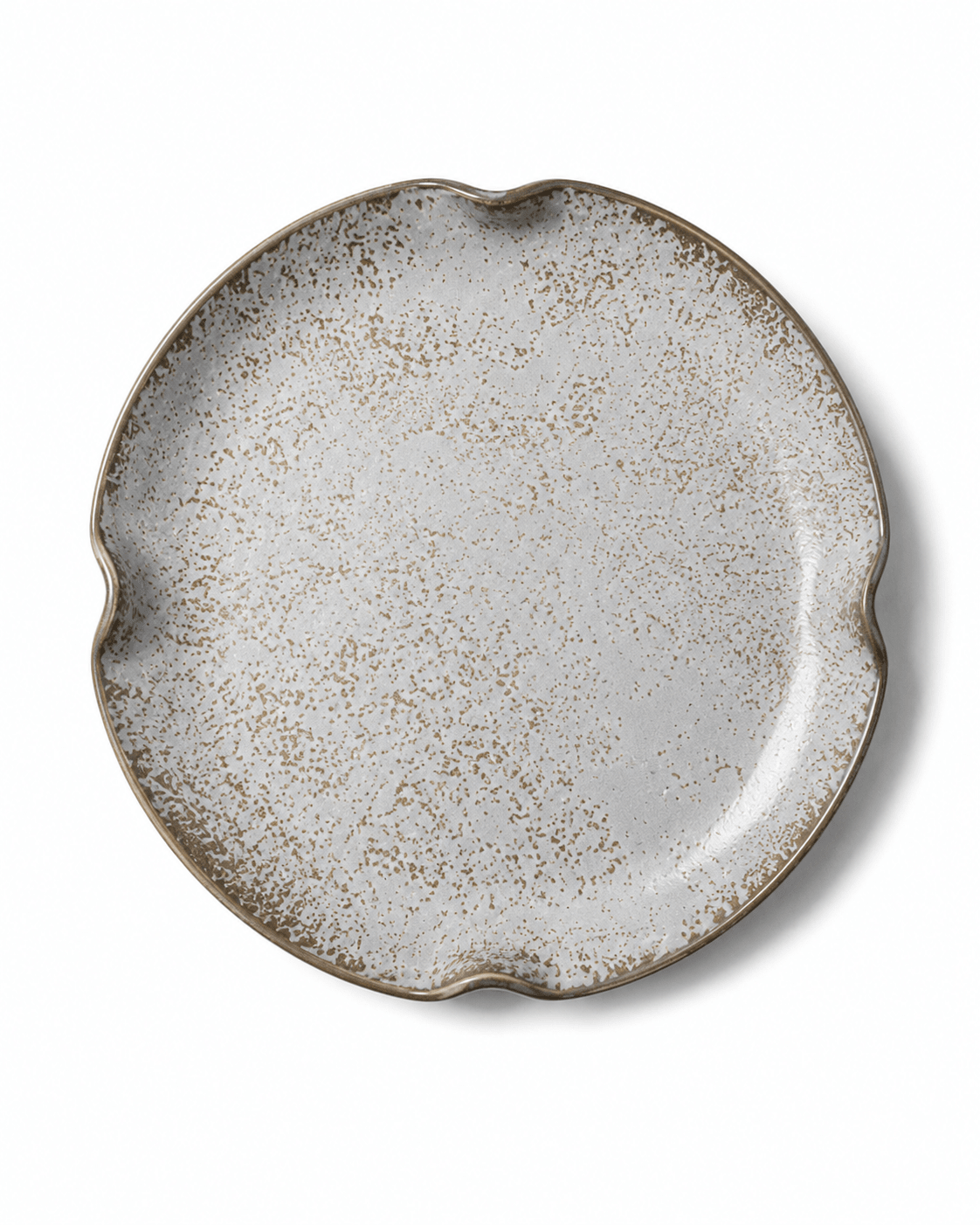 Top view of grey white speckled reactive glaze ceramic plate with brown detailing and four-point irregular rim