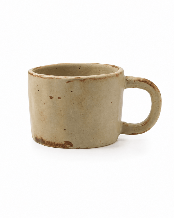 Handmade beige reactive glaze stoneware coffee mug with rustic brown accents and rounded handle