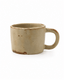 Handmade beige reactive glaze stoneware coffee mug with rustic brown accents and rounded handle