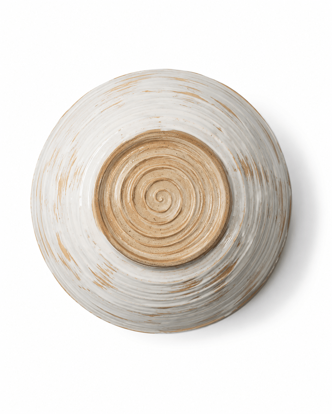 Bottom view of a handmade ceramic serving bowl showing the natural clay base and concentric pottery wheel marks