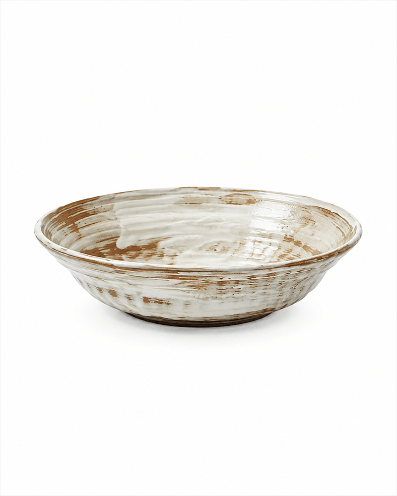 Side view of handmade white and brown reactive glaze ceramic serving bowl, 7.2 inch
