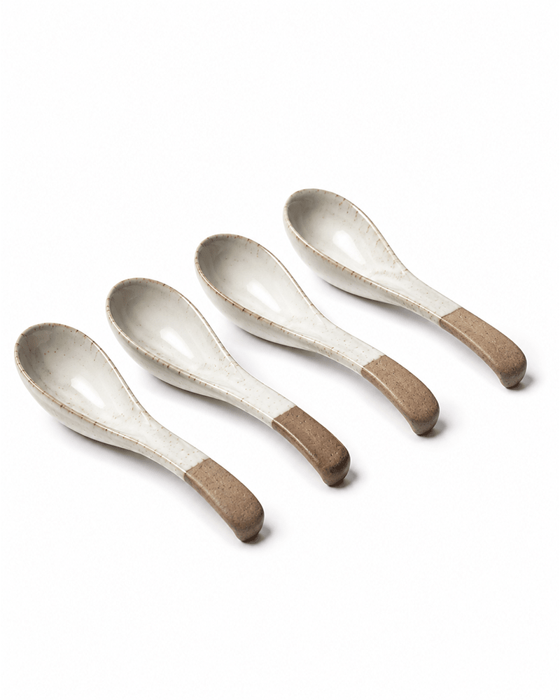 Set of handmade ceramic spoons with speckled glaze and natural clay handles