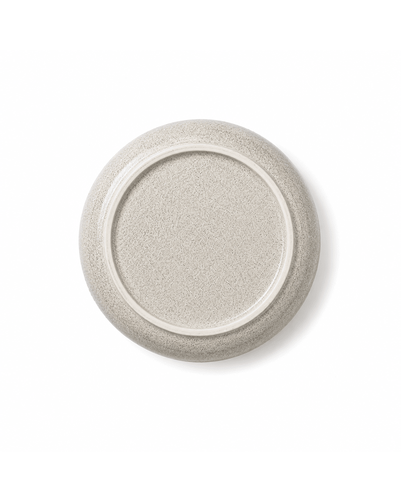 Bottom view of handmade grey ceramic bowl with speckled glaze and raised foot ring