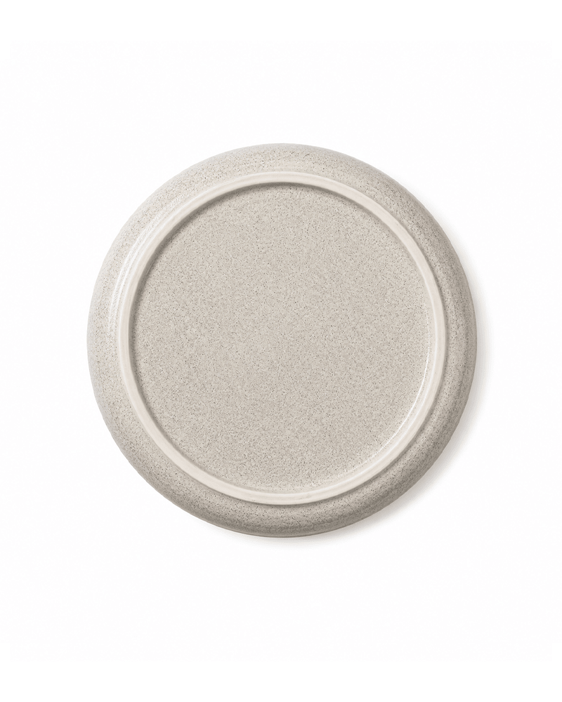 Bottom view of handmade grey ceramic side plate with speckled glaze and raised foot ring