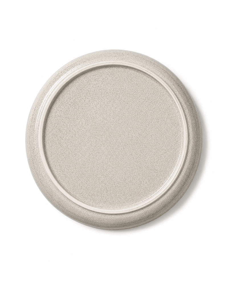Bottom view of handmade grey ceramic dinner plate with speckled glaze and raised foot ring