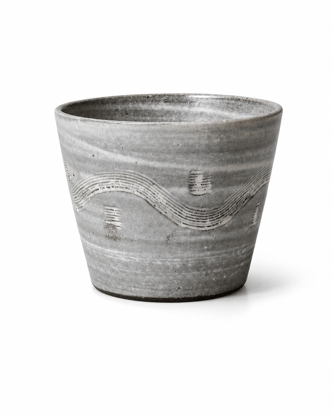 Handmade grey reactive glaze stoneware tumbler with white carved wave pattern and handleless design Main image