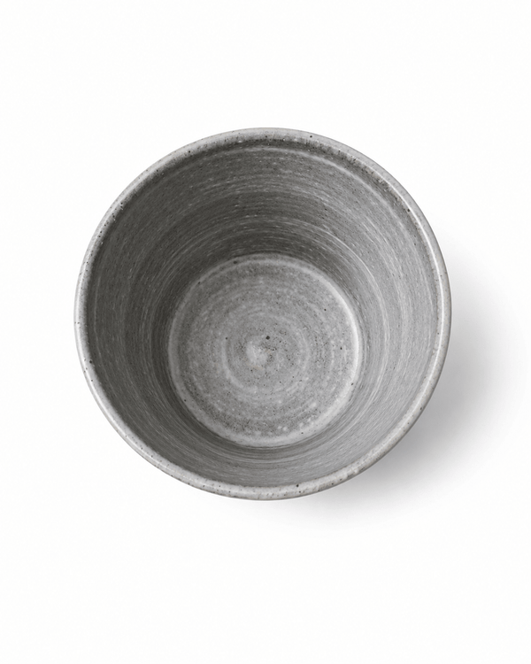 Top view of handmade grey stoneware tumbler showing the speckled glazed interior and wheel-thrown texture