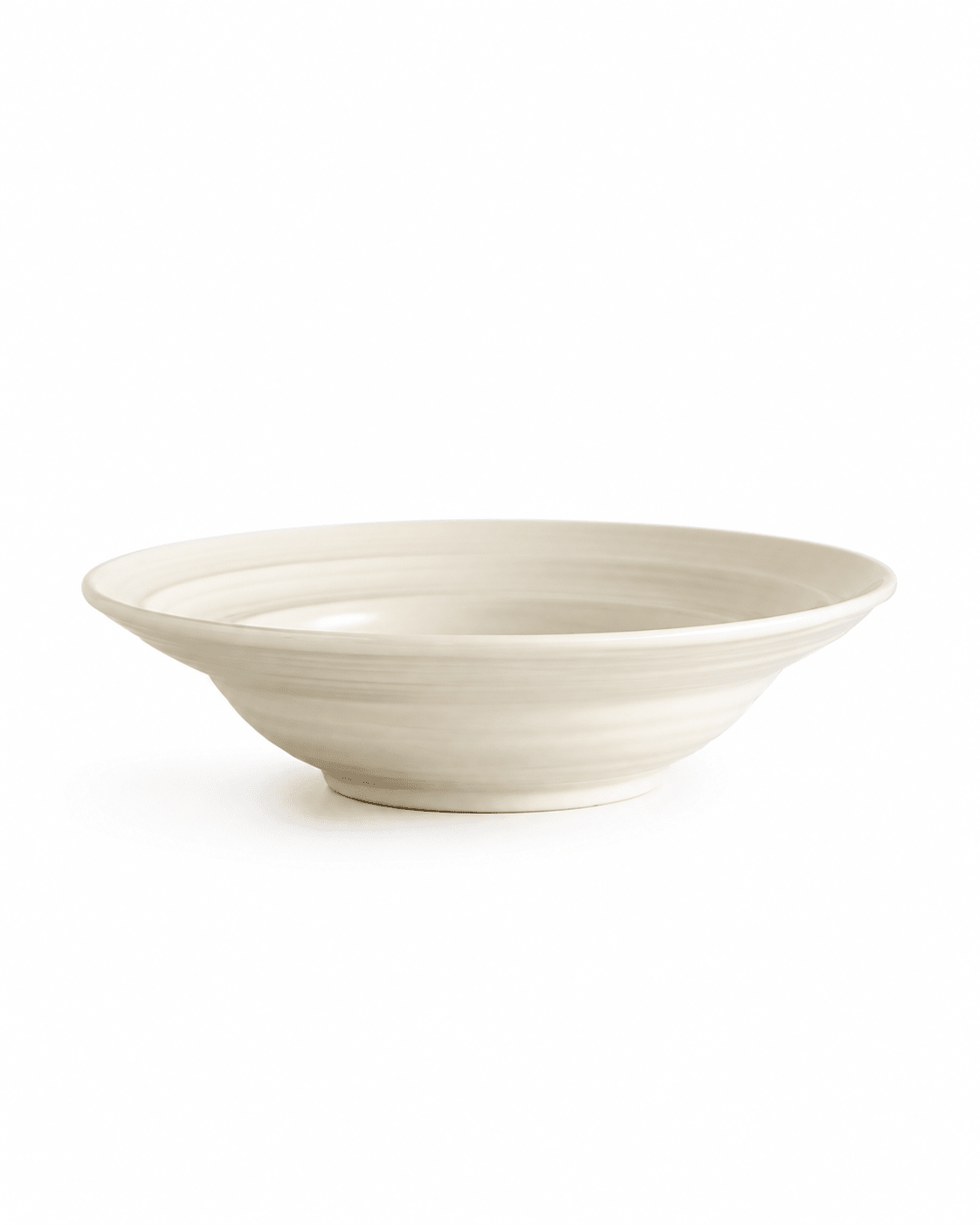 Side view of a handmade ivory stoneware pasta bowl with reactive glaze and subtle ridged texture Main image