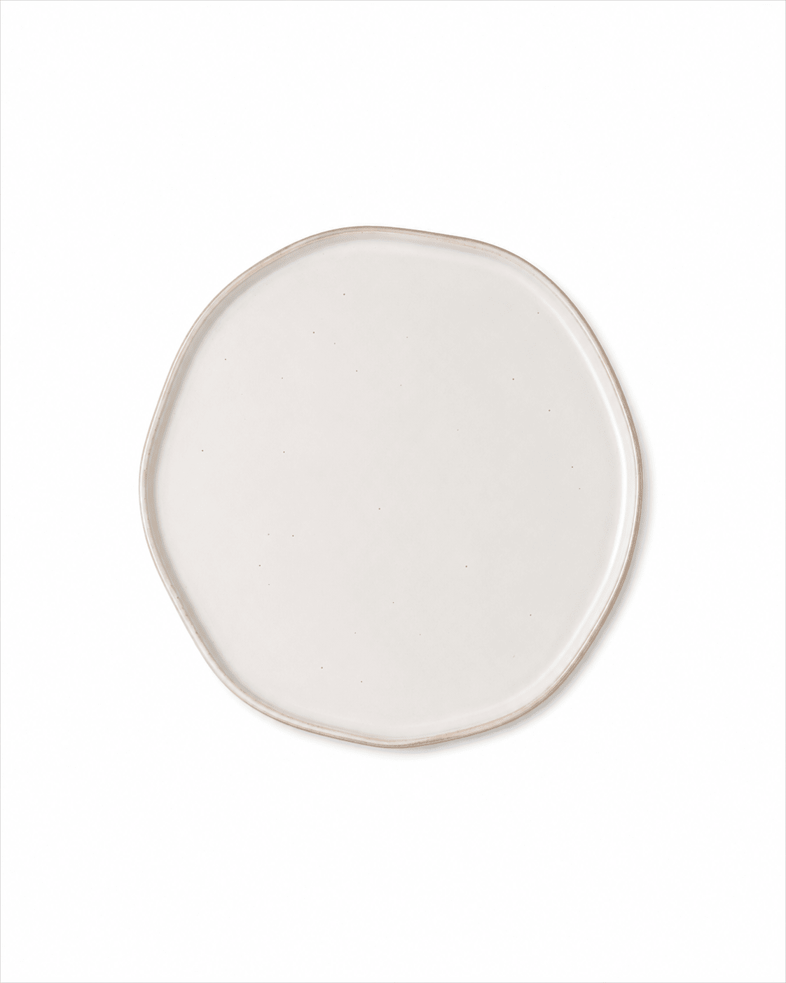 Top view of handmade ivory white ceramic dinner plate with organic irregular shape and subtle speckled glaze