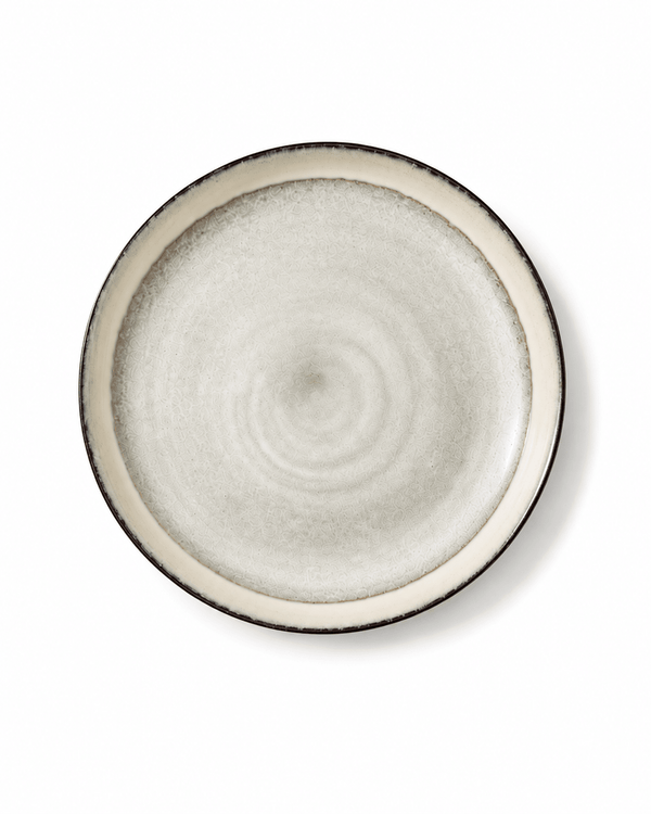 Top view of handmade off white reactive glaze 10.7 inch ceramic dinner plate with dark rim