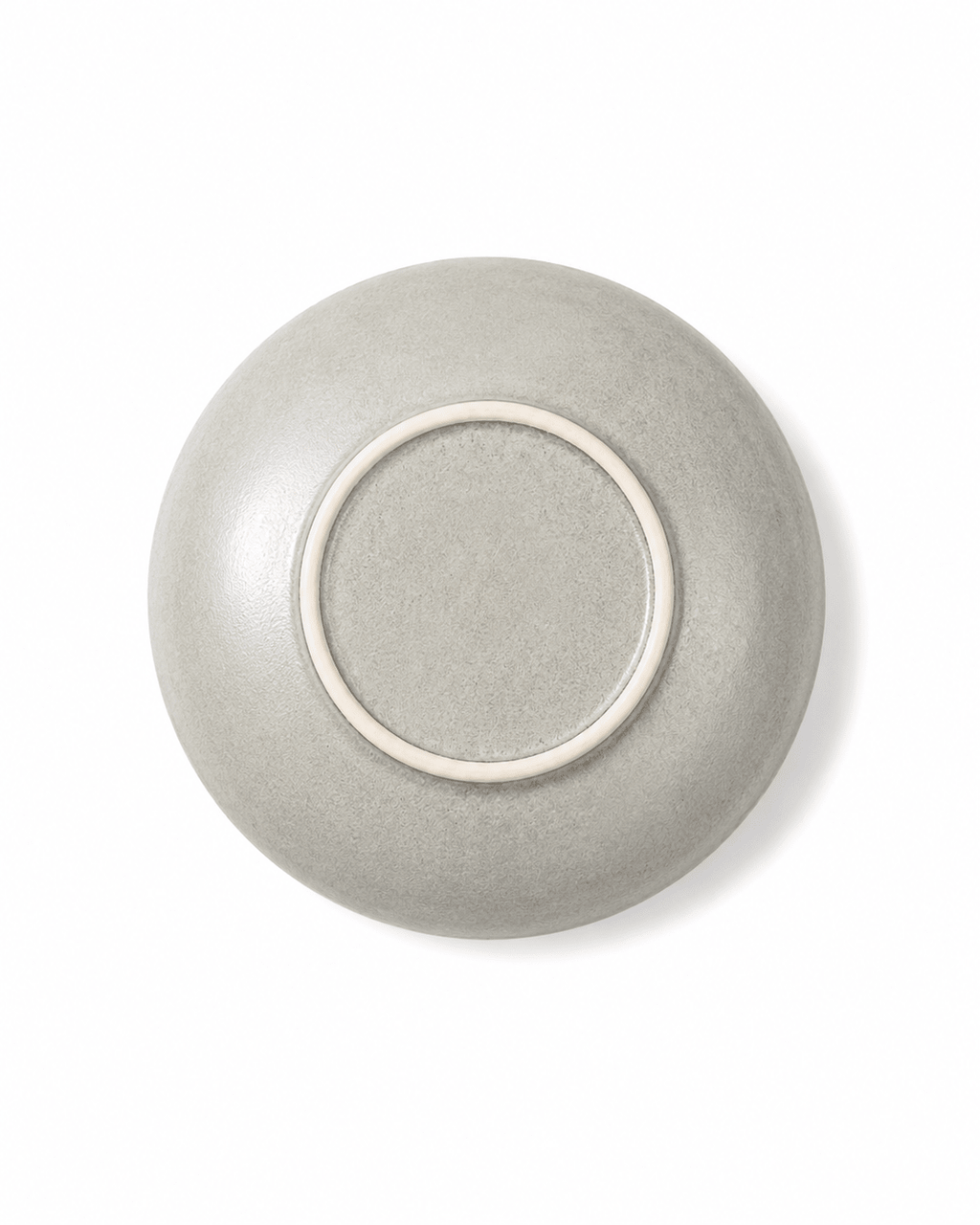 Bottom view of handmade off white reactive glaze 7 inch ceramic cereal bowl with raised foot ring