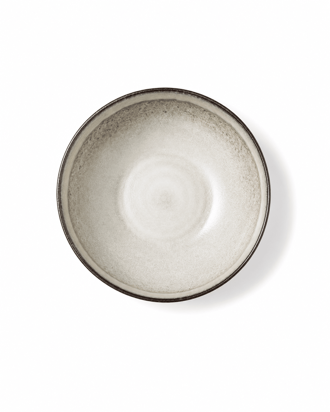 Top view of handmade off white reactive glaze 7 inch ceramic cereal bowl with dark rim