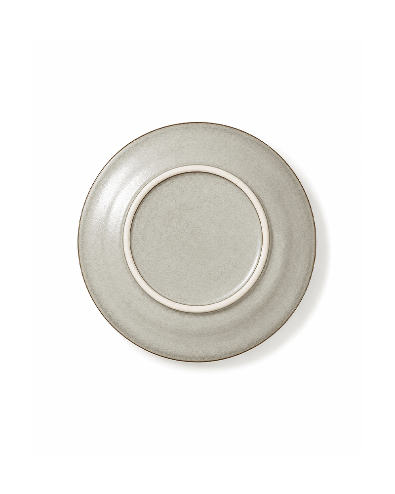 Bottom view of handmade off white reactive glaze 8 inch ceramic salad plate with raised foot ring