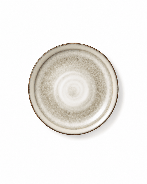 Top view of handmade off white reactive glaze 8 inch ceramic salad plate with rustic dark rim