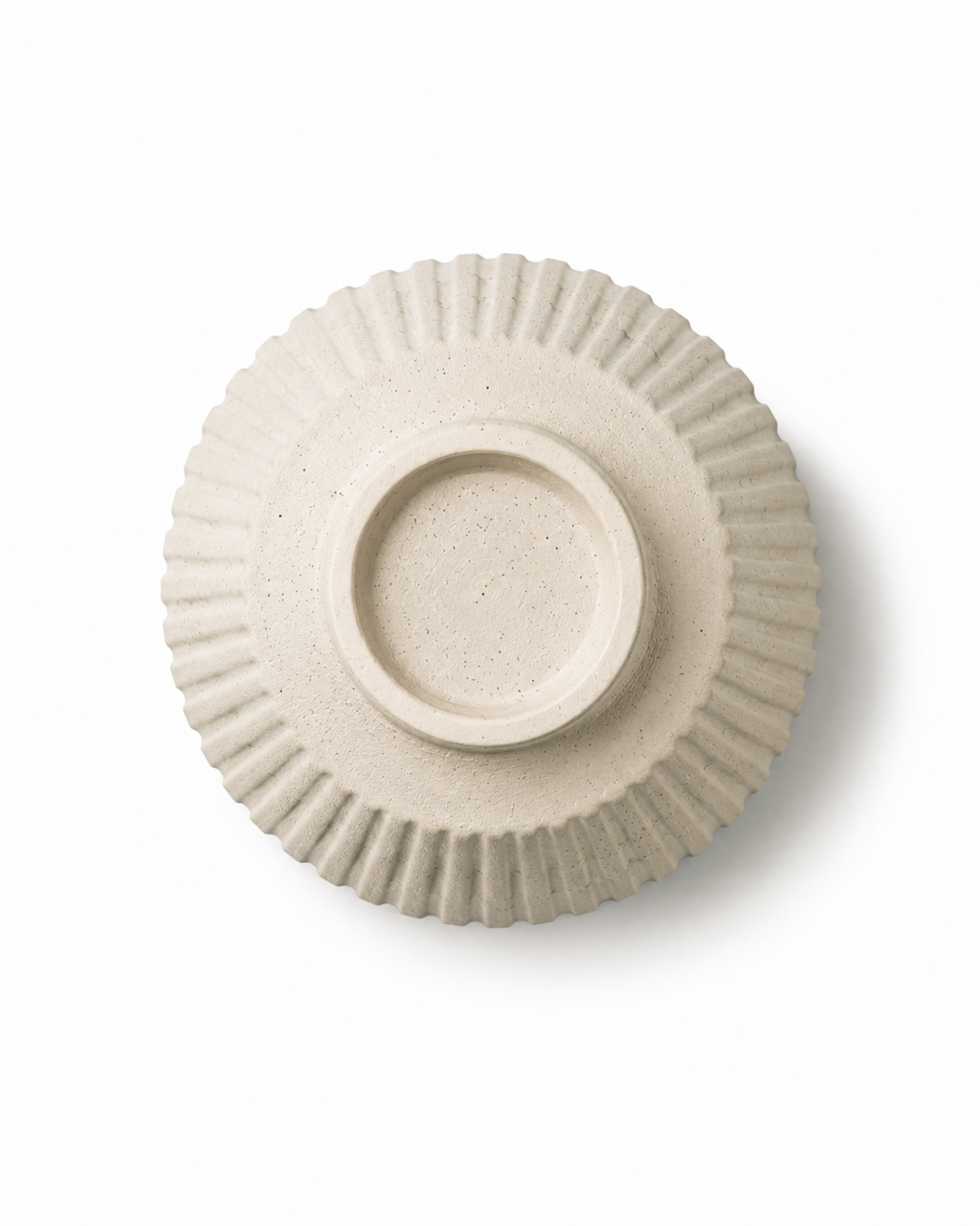 Bottom view of handmade off-white ribbed stoneware vase showing circular foot and natural speckled finish