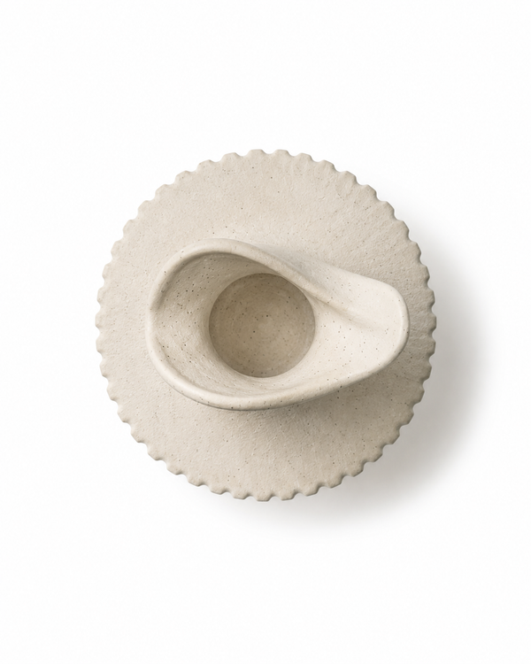 Top view of handmade off-white stoneware vase showing sculptural wavy opening and speckled ceramic texture