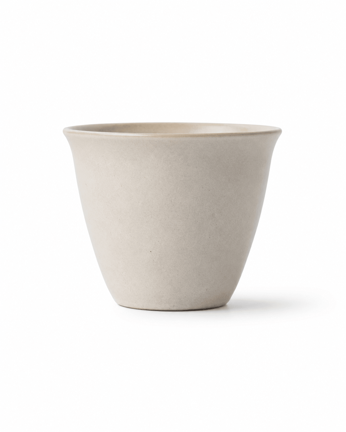 Front view of handmade off-white stoneware tea cup with a minimalist handleless design Main image