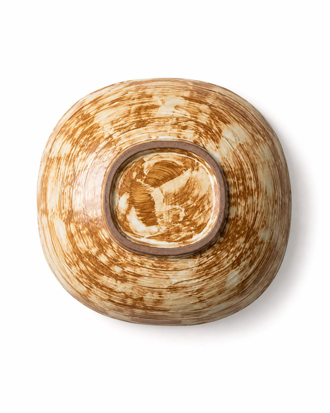 Bottom view of handmade brown and cream reactive glaze ceramic pasta bowl showing the unglazed foot ring and hand-finished glaze pattern