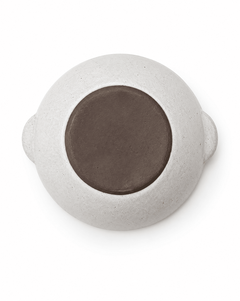 Bottom view of handmade speckled ceramic serving bowl showing the unglazed dark clay base