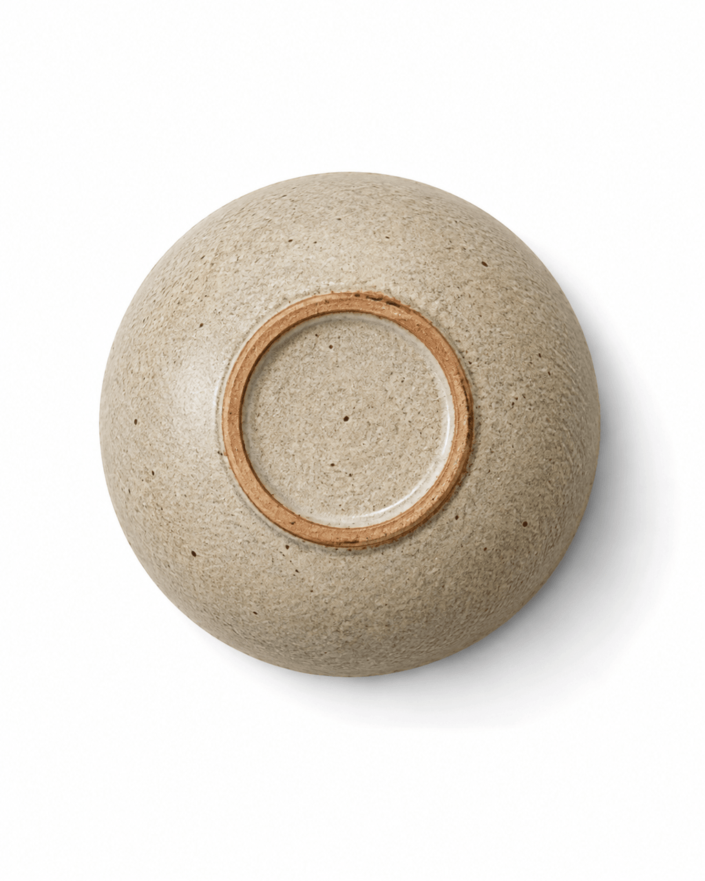 Bottom view of handmade speckled stoneware mini dish showing natural clay foot ring
