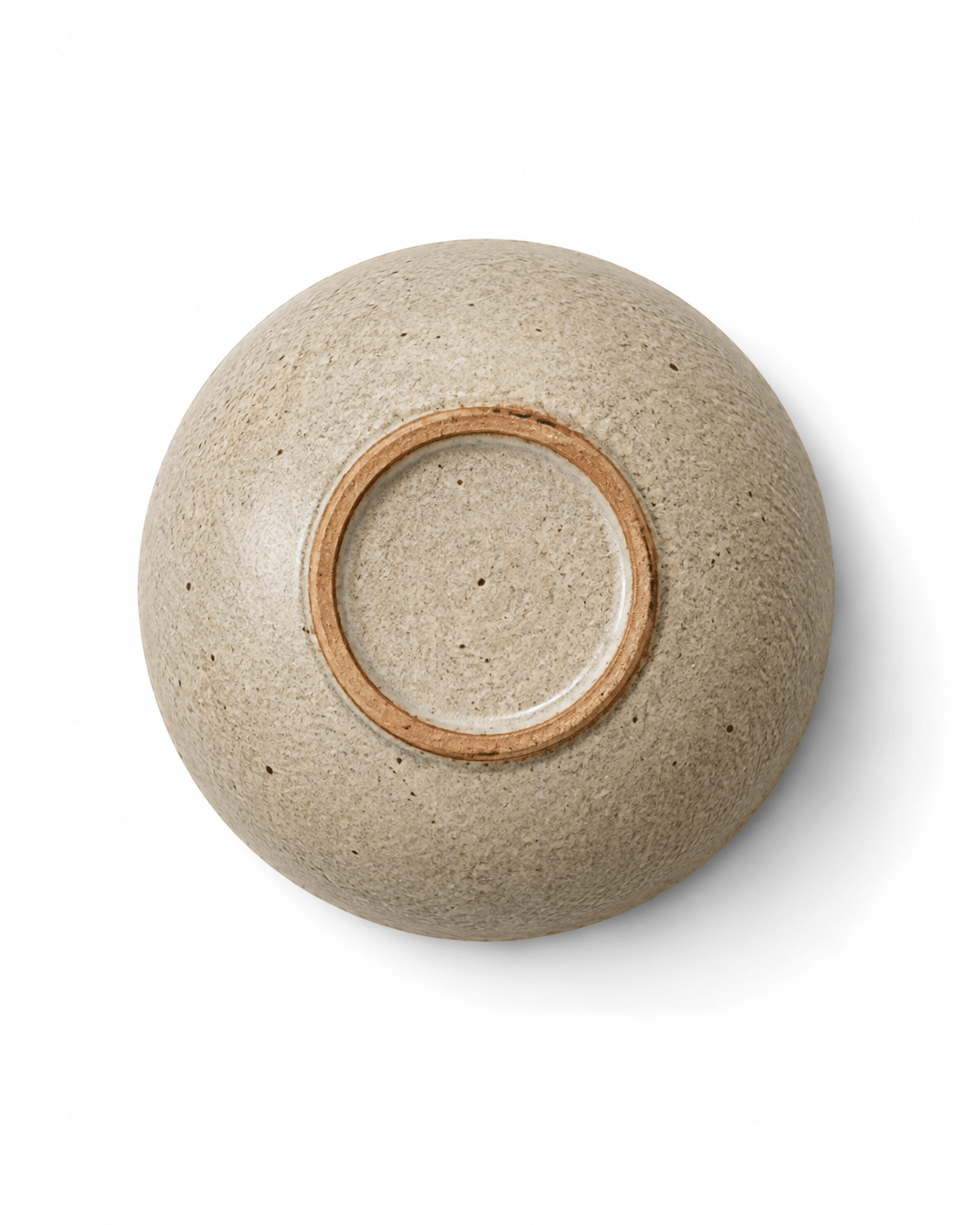 Bottom view of handmade speckled stoneware mini dish showing natural clay foot ring
