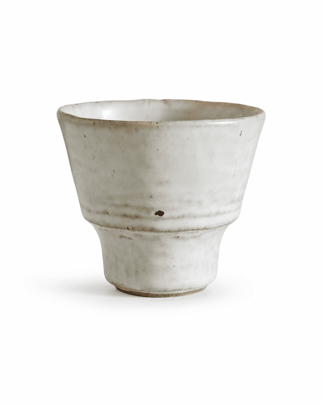 Handmade speckled white stoneware yunomi tea cup with a handleless footed design and irregular rim Main image