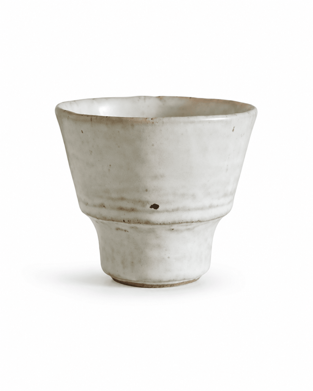 Handmade speckled white stoneware yunomi tea cup with a handleless footed design and irregular rim