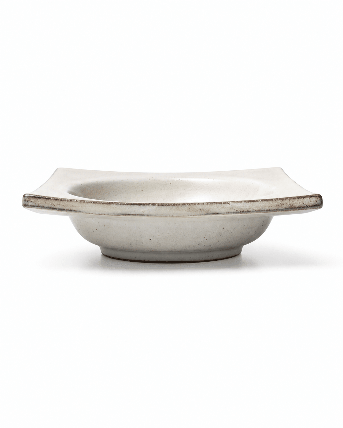Side view of handmade square ceramic dipping bowl with raised edges and shallow centre Main image