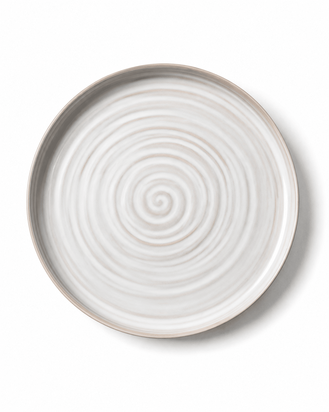 Top view of handmade white and beige ceramic dinner plate with concentric wheel-thrown texture and raised rim