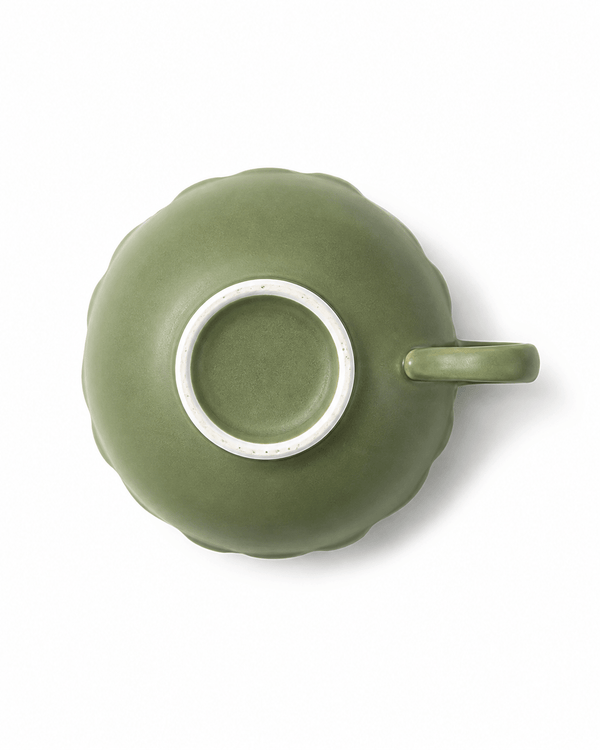 Bottom view of olive green handmade ceramic coffee cup showing unglazed foot ring and handle