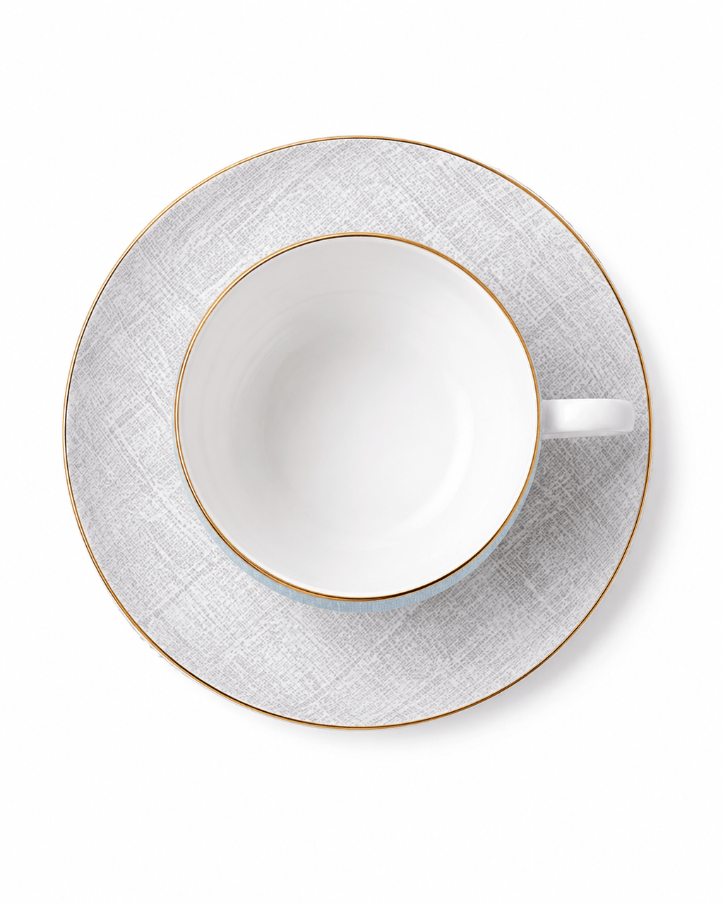 Top view of pale blue bone china cup and grey patterned saucer with fine gold rims
