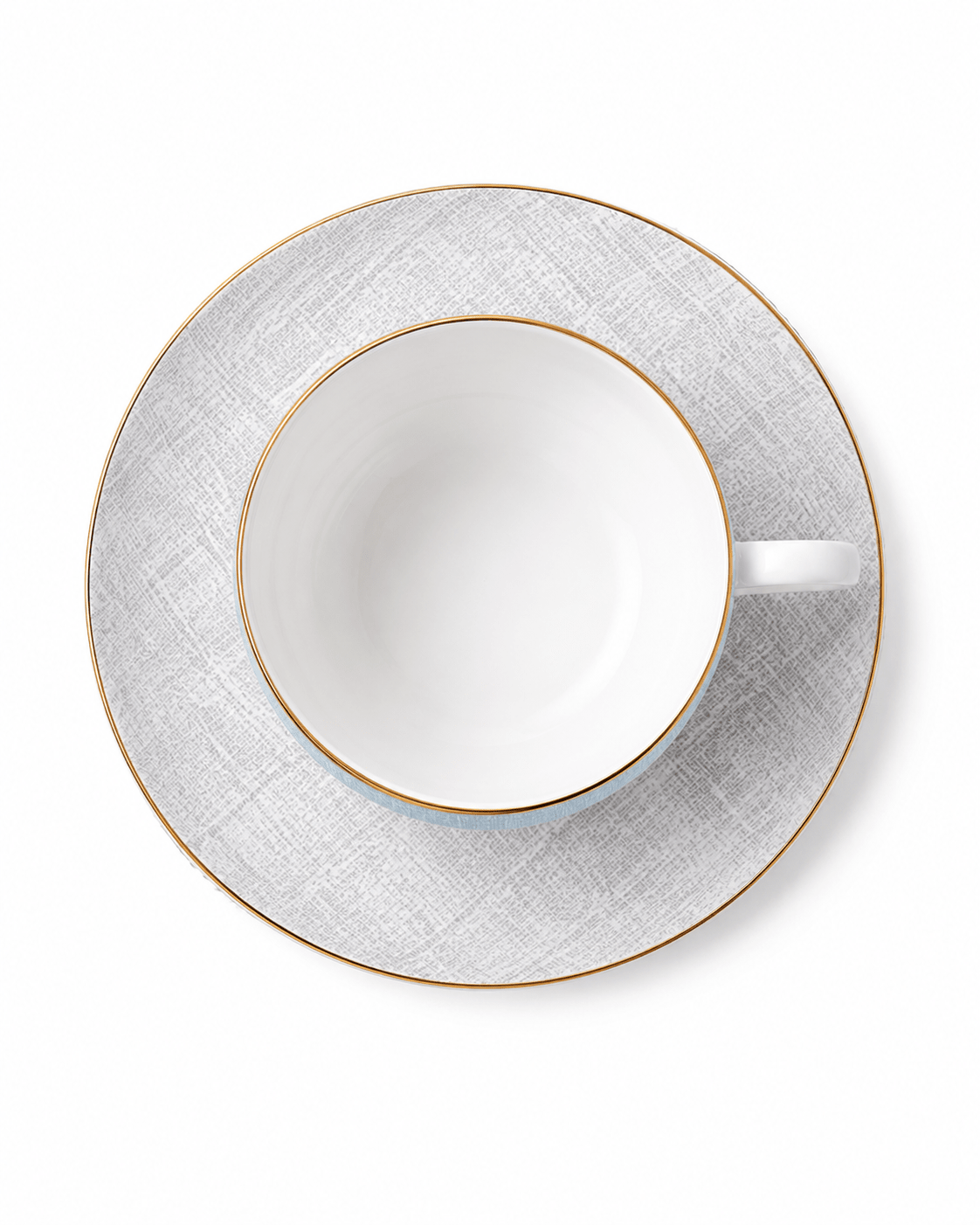 Top view of pale blue bone china cup and grey patterned saucer with fine gold rims