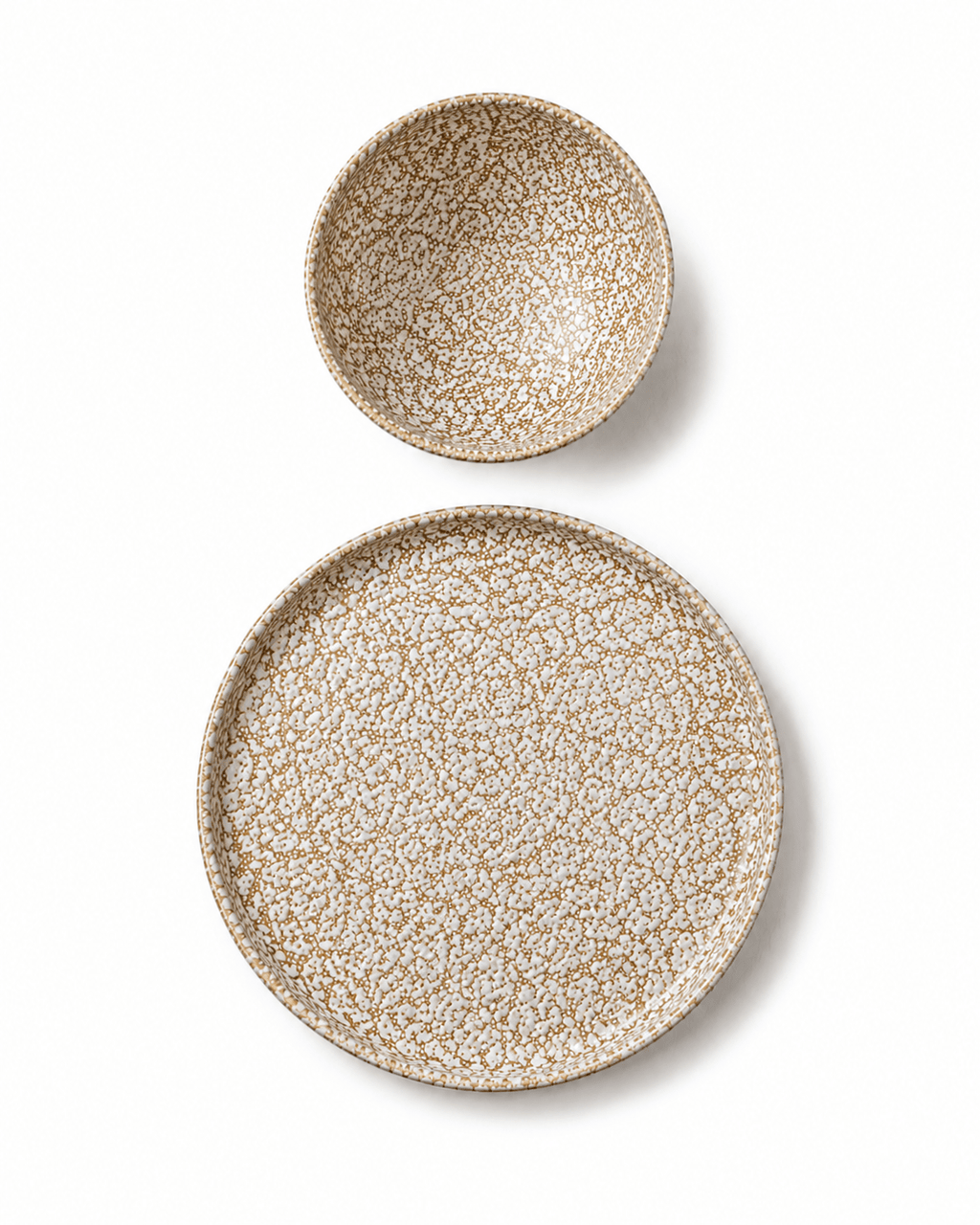 Brown and cream reactive glaze stoneware bowl and side plate top view