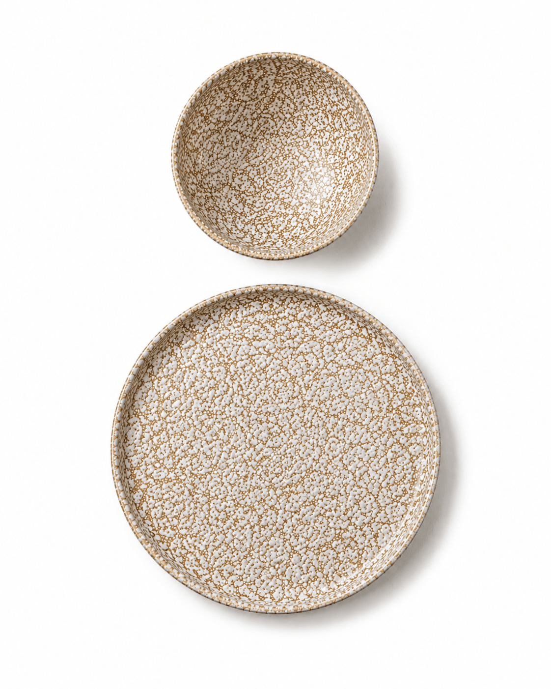 Brown and cream reactive glaze stoneware bowl and side plate top view