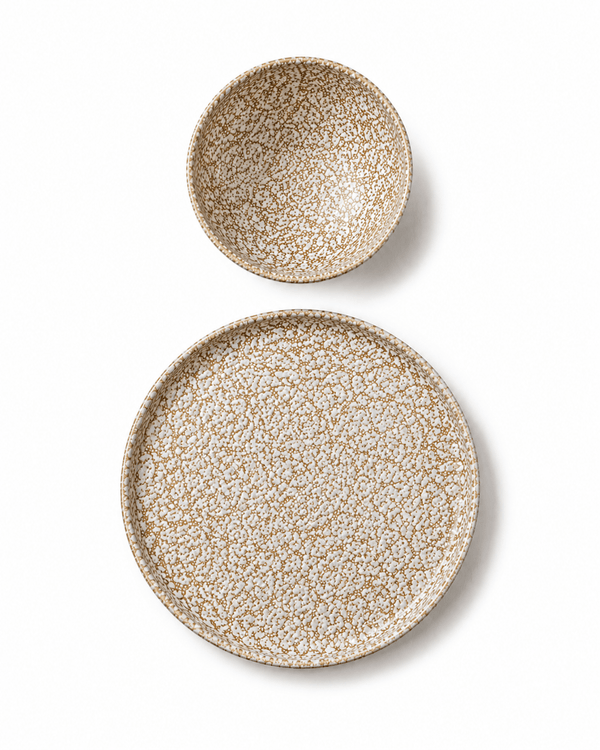 Brown and cream reactive glaze stoneware bowl and side plate top view