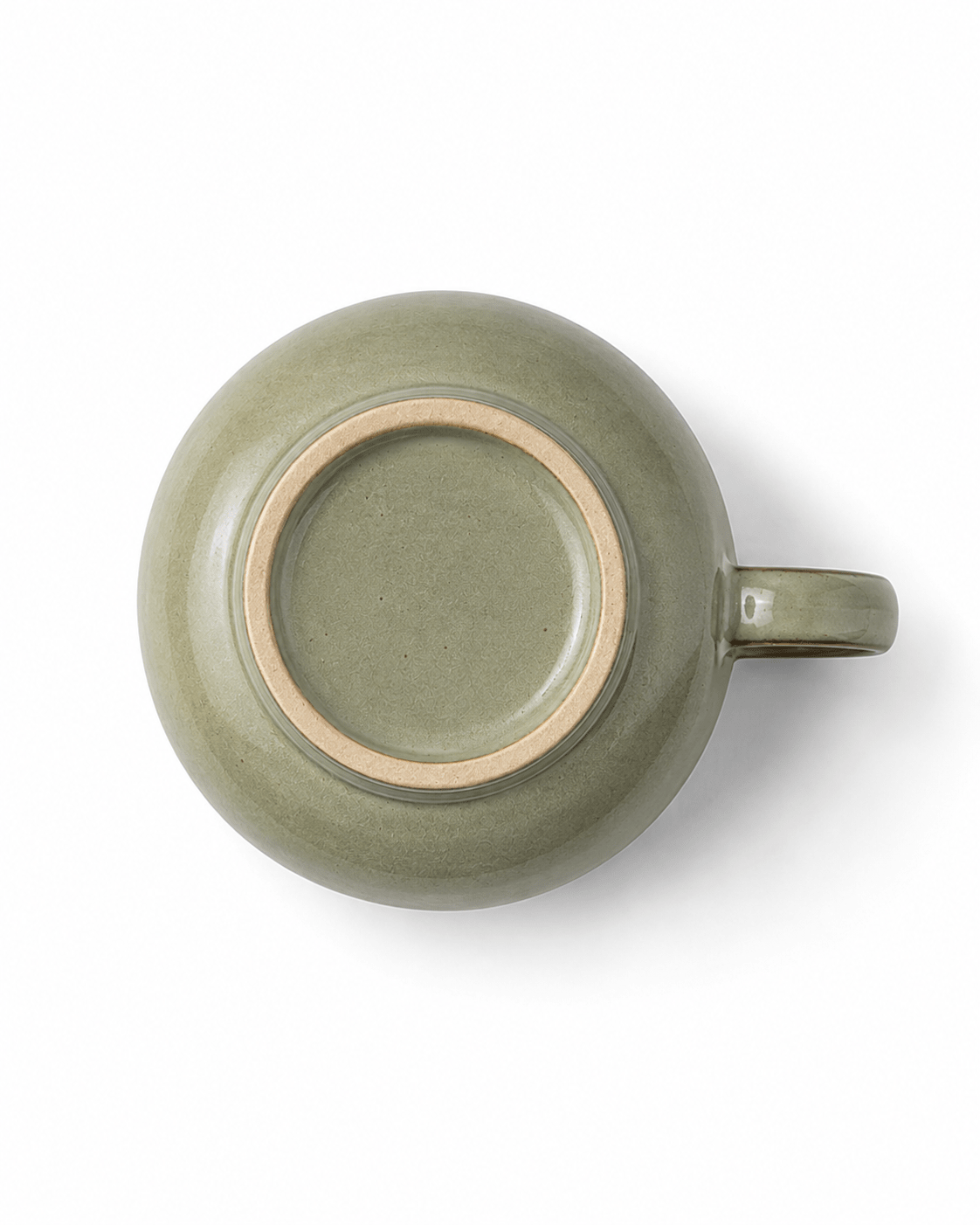 Bottom view of sage green reactive glaze ceramic coffee cup showing the natural foot ring