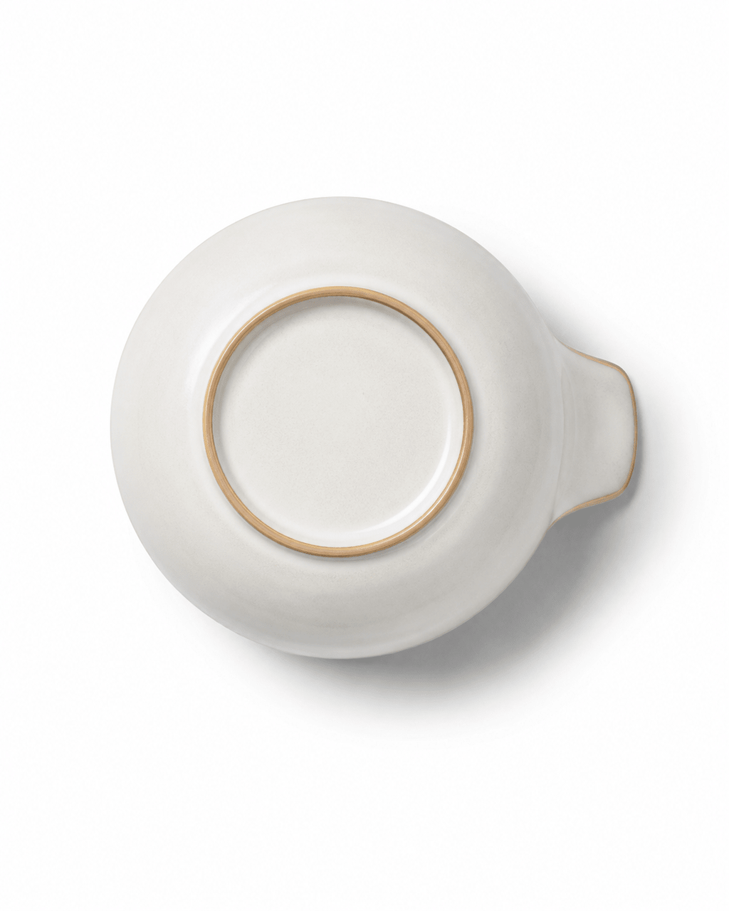 Bottom view of small handmade ceramic bowl with handle showing the raised foot ring and ivory ceramic finish