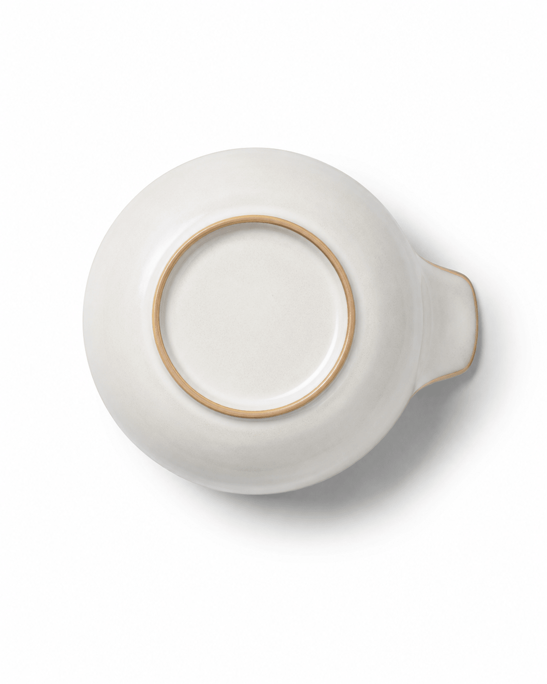 Bottom view of small handmade ceramic bowl with handle showing the raised foot ring and ivory ceramic finish