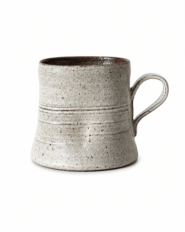 Speckled handmade ceramic mug with rustic glaze and loop handle