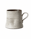 Speckled handmade ceramic mug with rustic glaze and loop handle